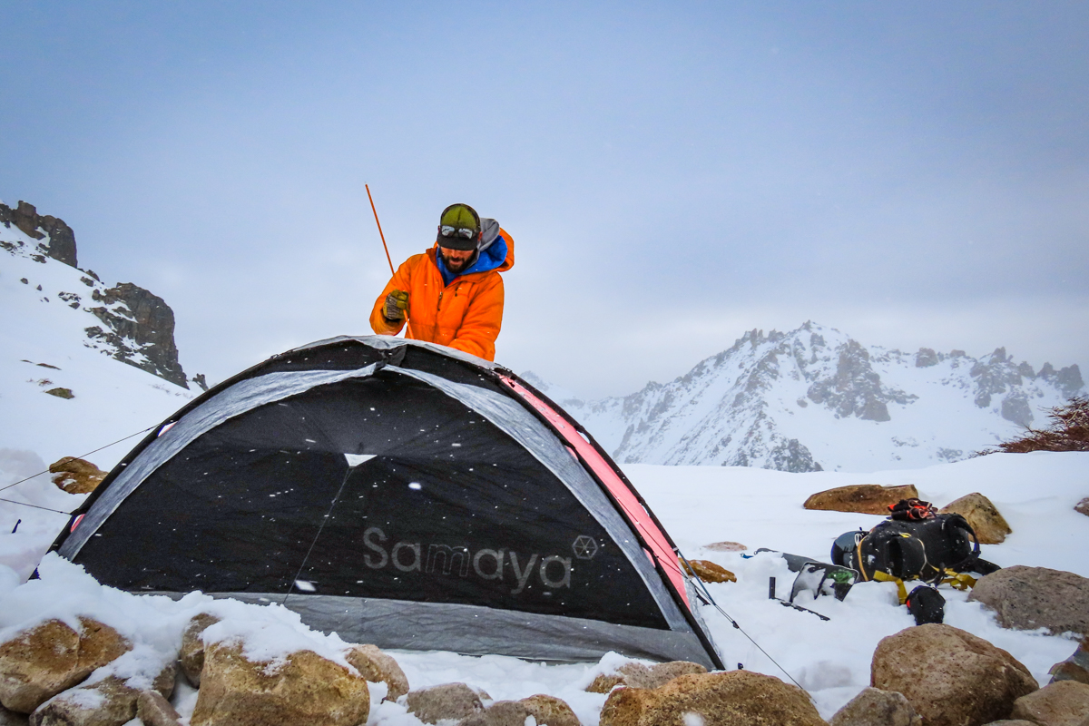 A man setting up the Samaya 2.0 tent