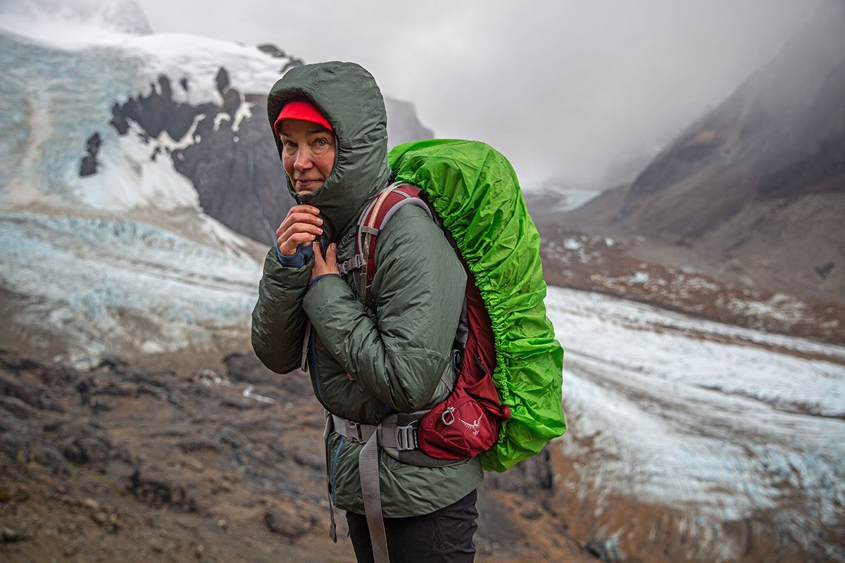 A woman backpacking in a synthetic jacket