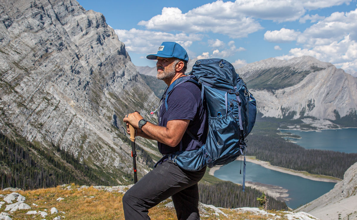 A man backpacking with a GPS watch
