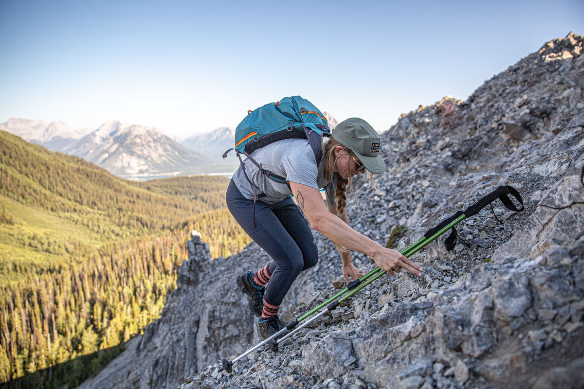 A woman scrambling in a pair of hiking shoes
