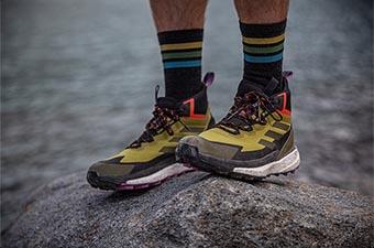 A hiker wears Adidas Terrex shoes for their hike.