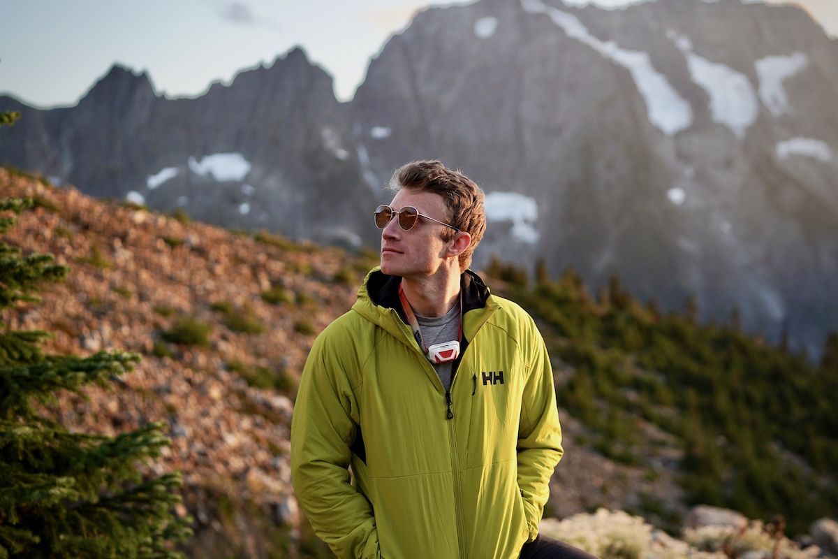 A man standing in front of mountains