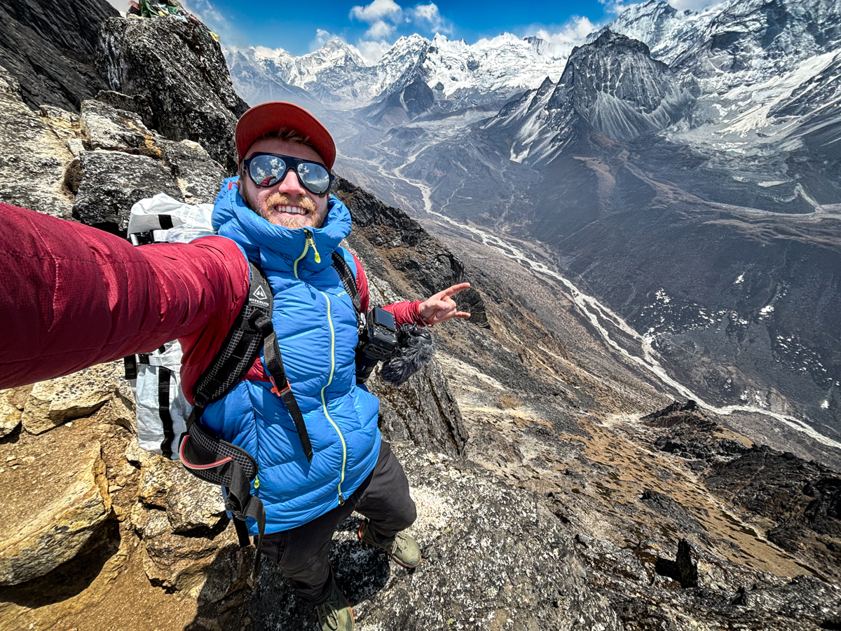 A man hiking in Nepal with a Sony camera