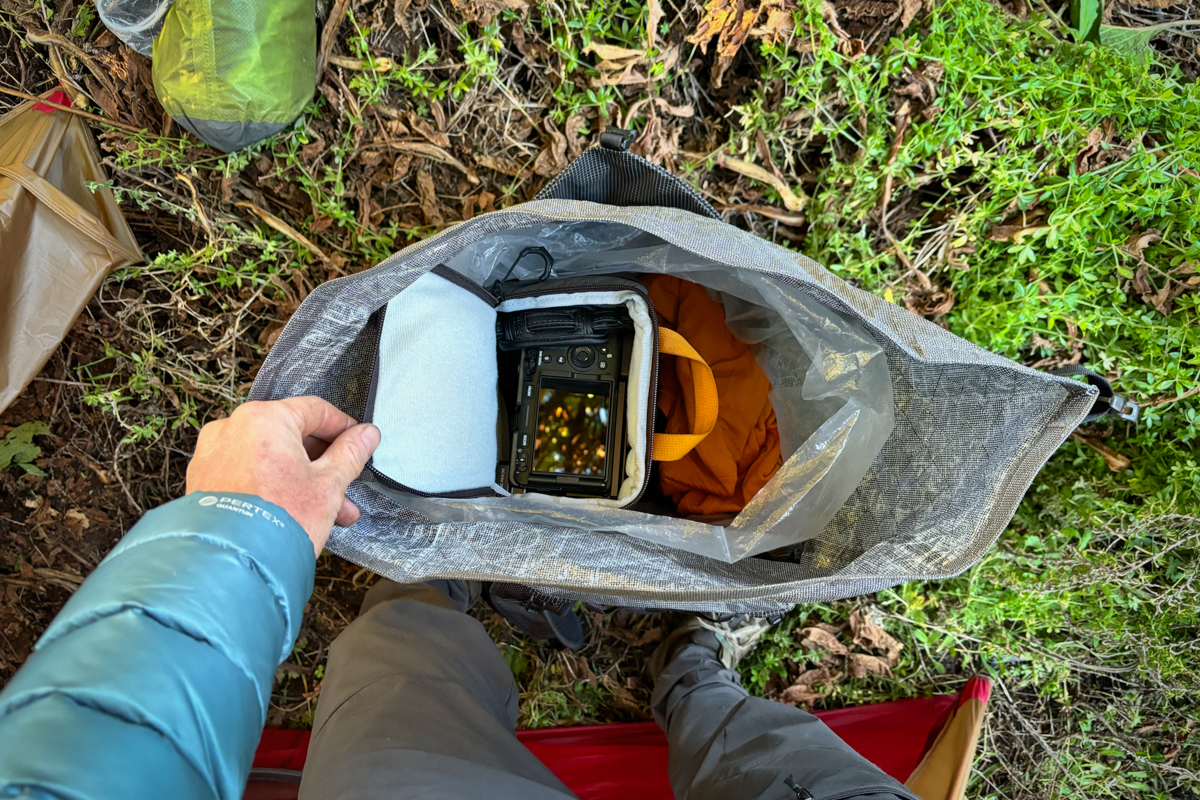 Closeup of a camera in a camera cube inside a backpack