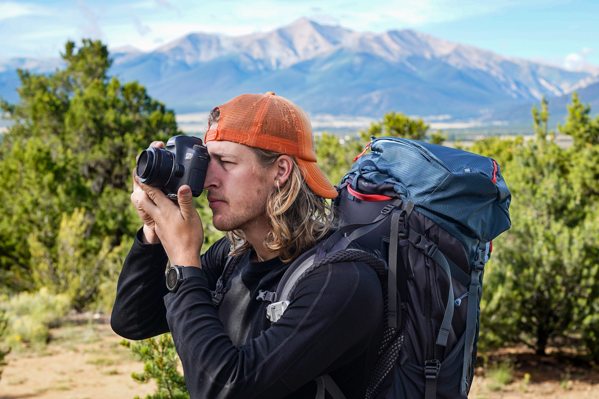 A man taking a photo with a DSLR