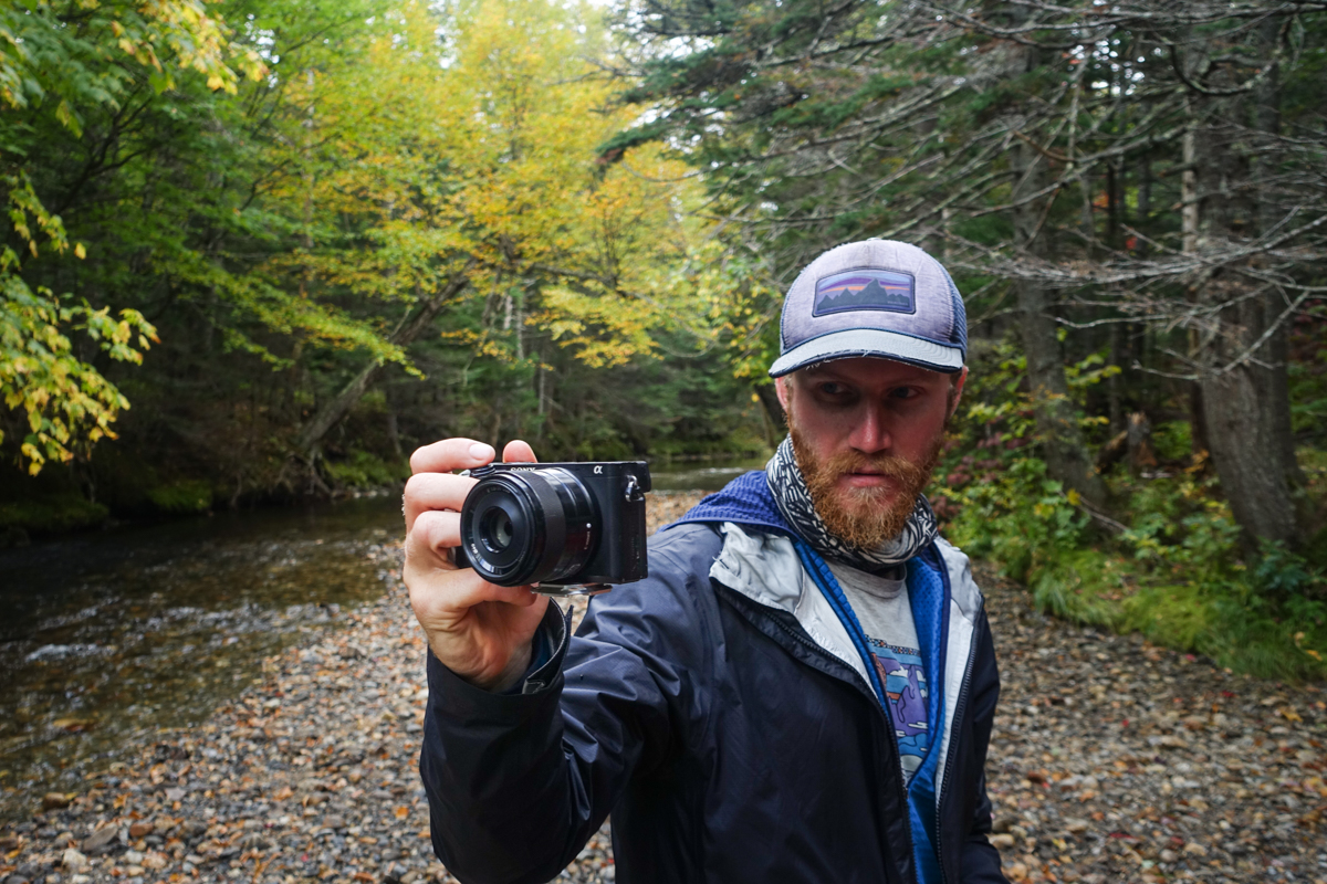 A man taking a photo with a sony camera