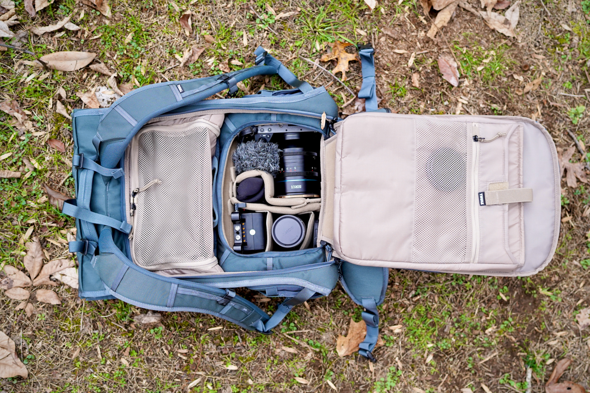 A camera backpack packed with camera gear