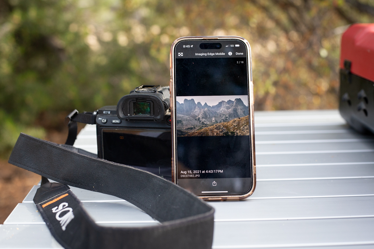 A phone taking photos from a camera