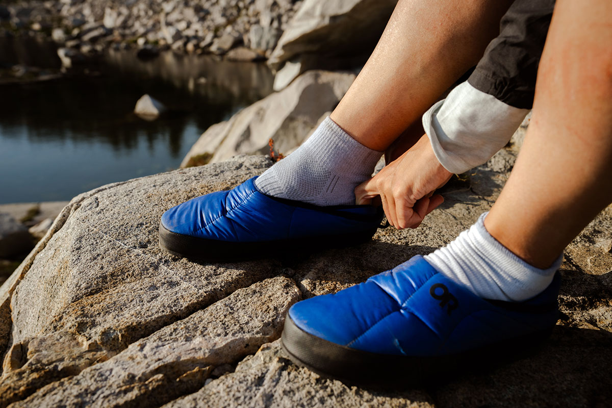 Putting on blue camp shoes