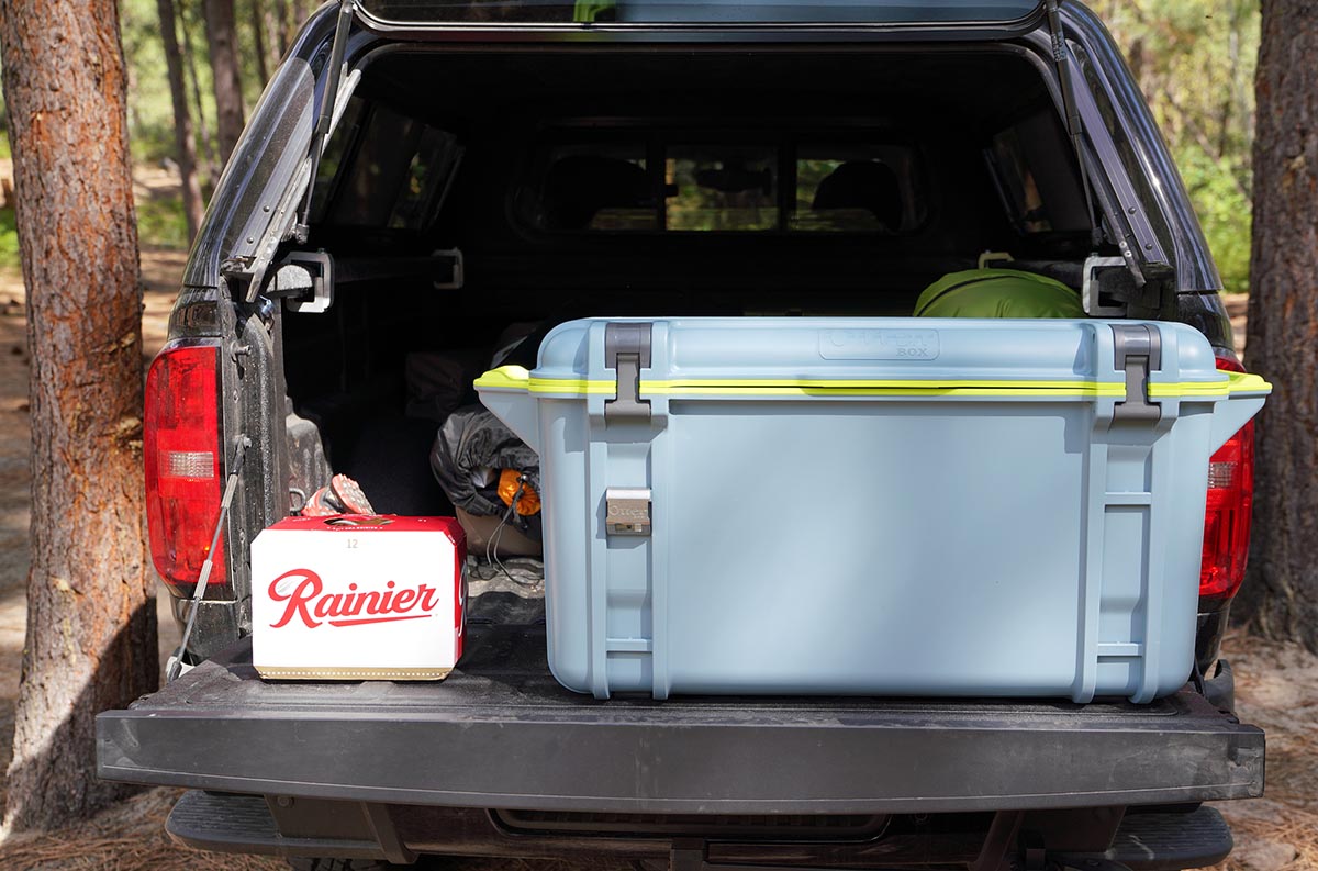 A cooler sitting in a truckbed