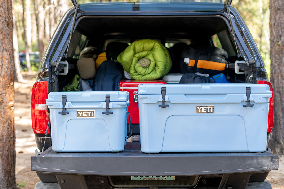Two coolers side by side on a tailgate