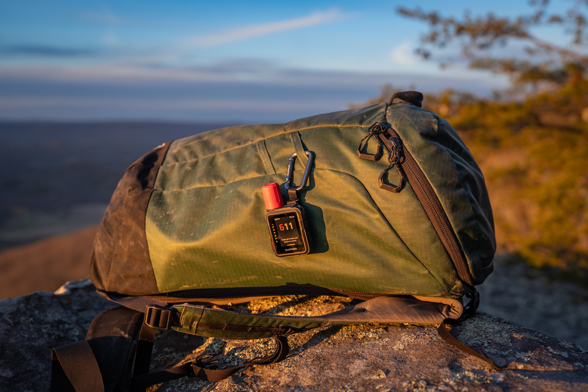The inReach Mini 3 clipped to a backpack