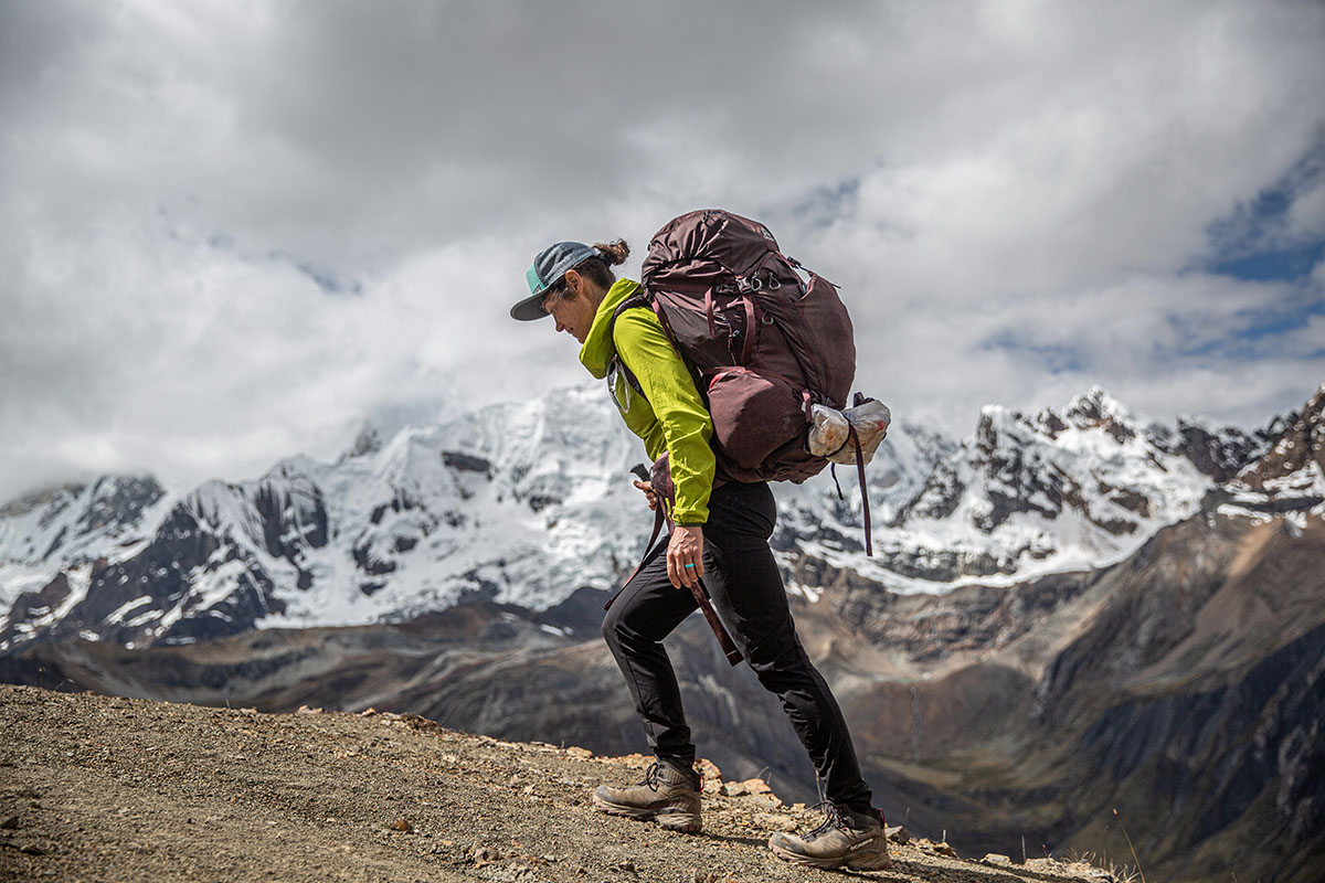 A woman backpacking in the Scarpa Rush TRK GTX