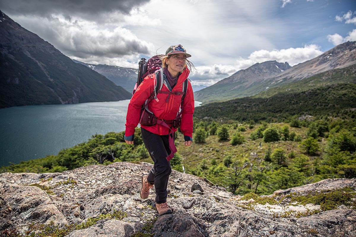 A woman hiking across rocks in the Altra Lone Peak Hiker 2
