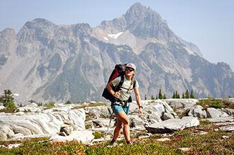 A woman hikes in the Alpine Lakes Wilderness