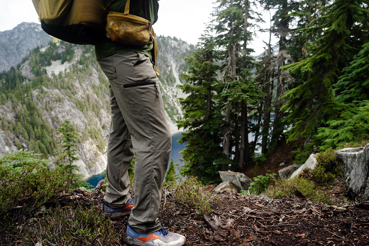 A man hiking with the REI Trailmade pants