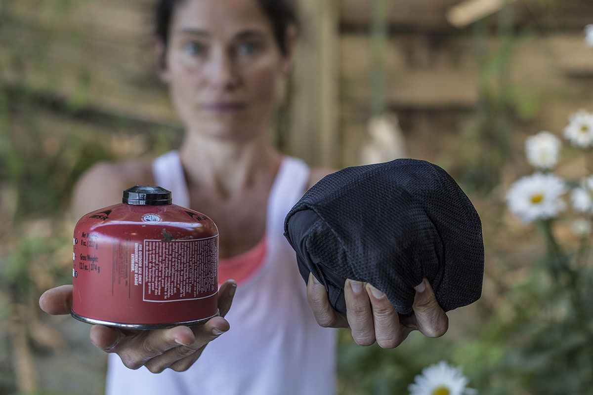 Hiking pants packed down to the size of a small fuel canister