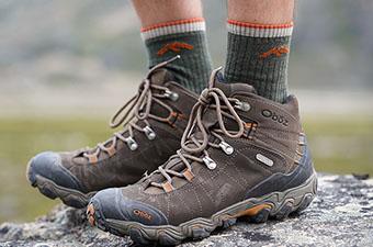A close up of Darn Tough socks with Oboz Bridger boots