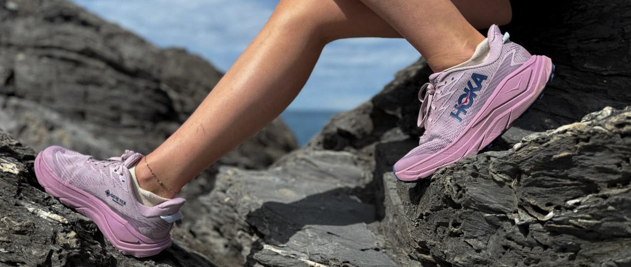 A pair of Hoka Challenger 8 GTX runners on a rock. 