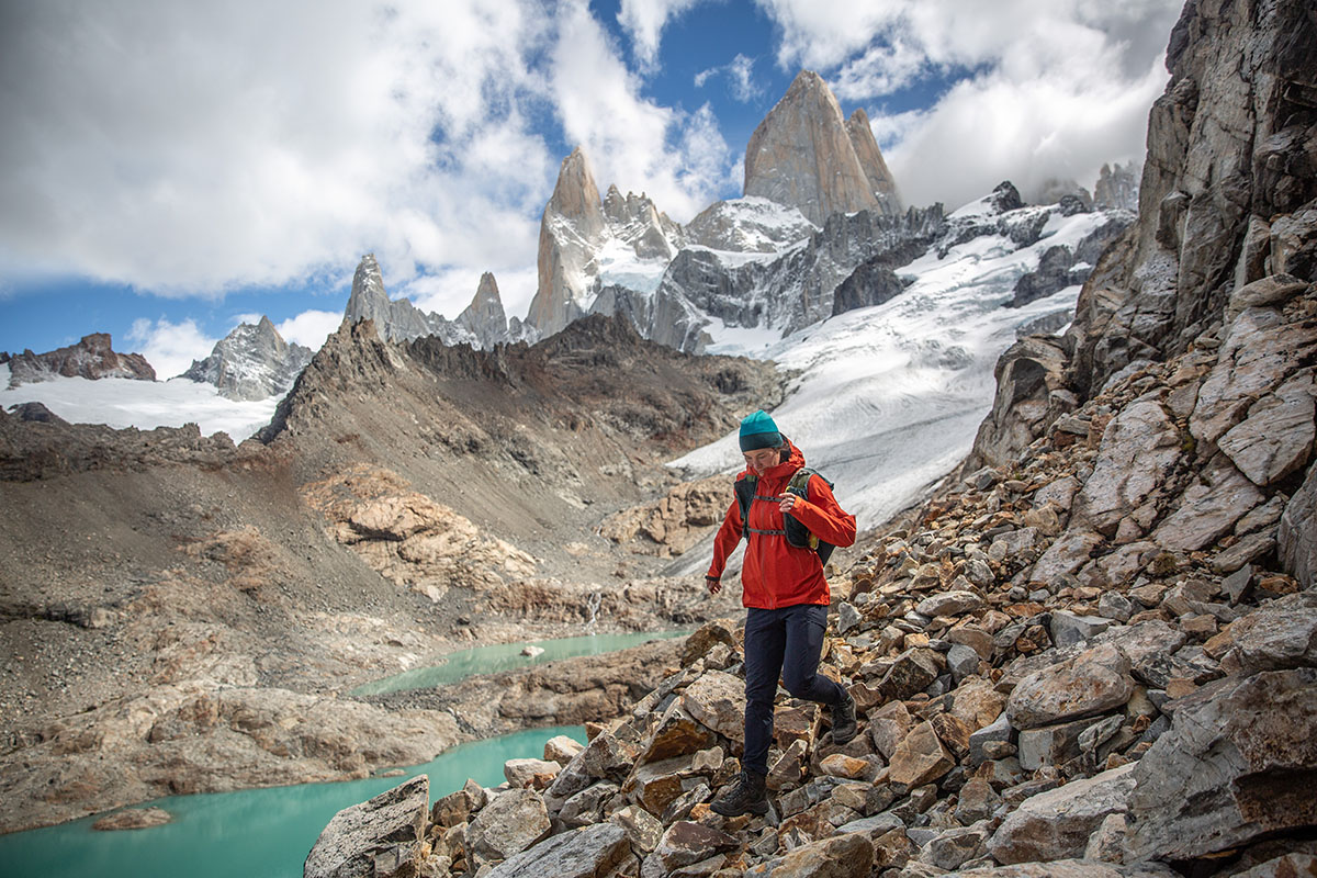 A woman hiking down a steep rocky section in the Lowa Renegade GTX Mid hiking boot