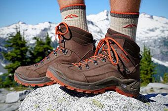 A closeup of the Lowa Renegade hiking boots standing on a rock