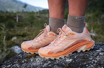 Merrell Moab Speed 2 GTX hiking shoe posed on a rock. 