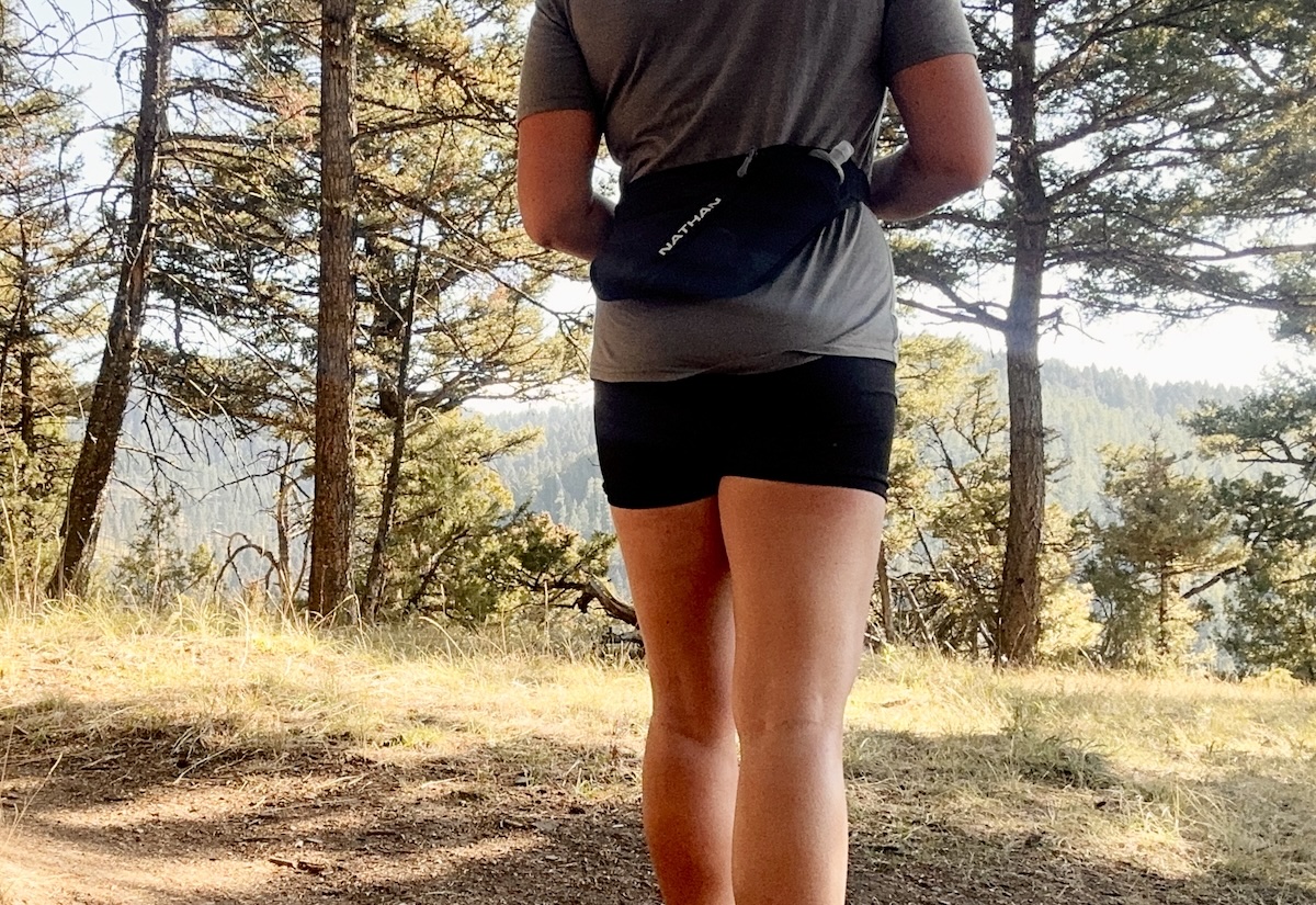 a waist-down image of a woman wearing a running waist pack