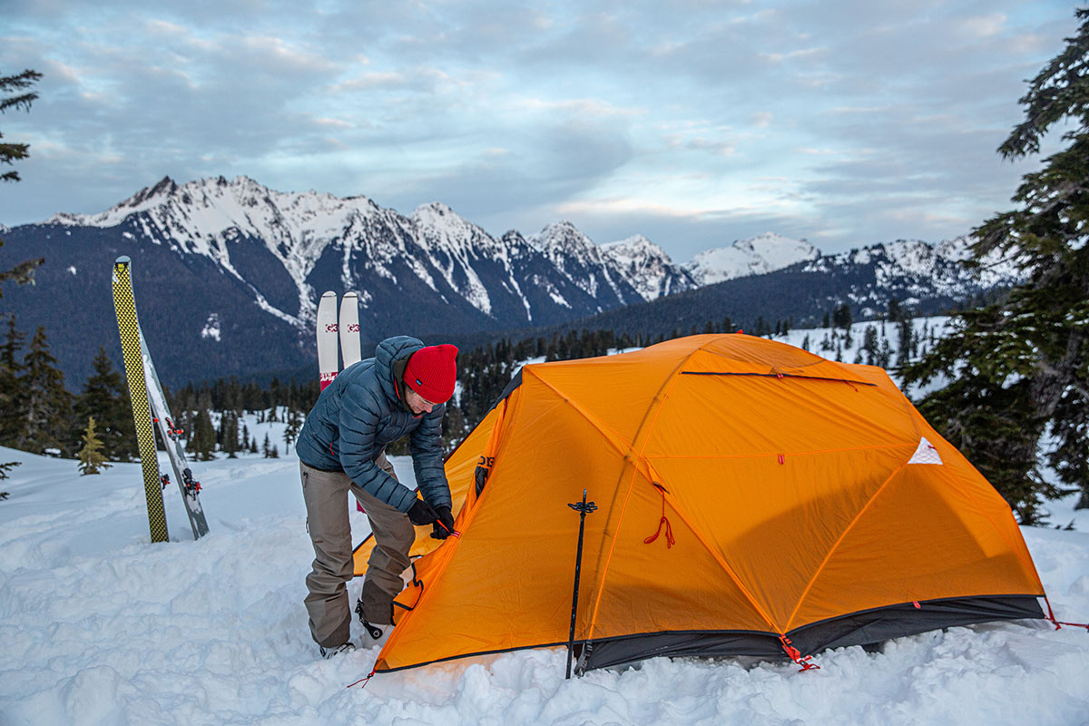 A woman pitching the Nemo Kunai 3P tent