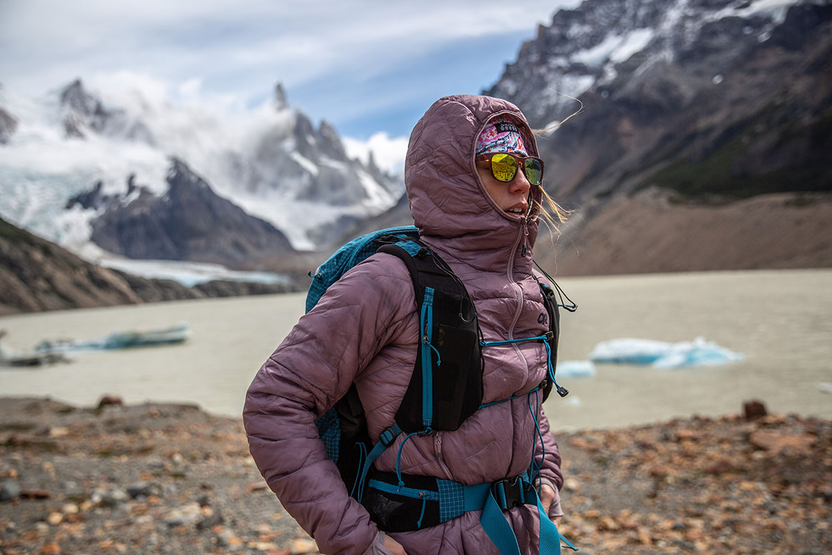 A woman testing the Outdoor Research SuperStrand LT Hoodie in Patagonia