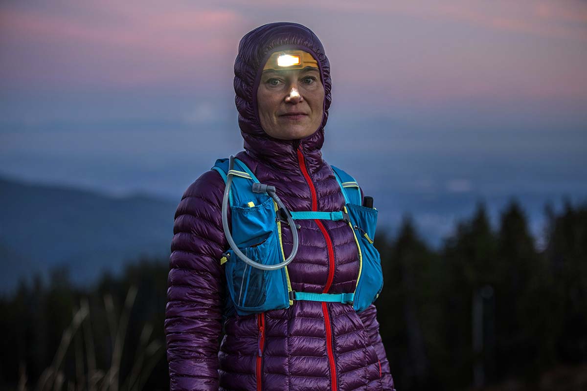 A runner goes out at dusk with a vest and headlamp.