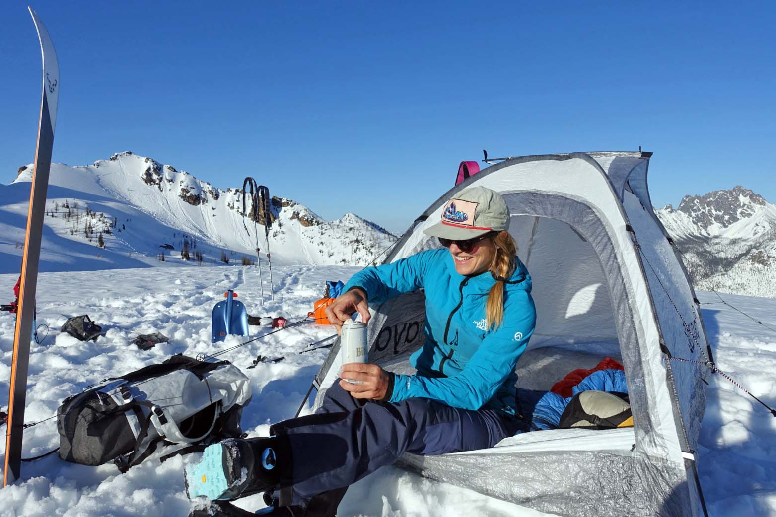 A woman sitting in the Samaya Assault2 Ultra 4-season tent