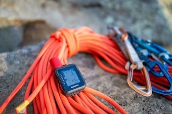 A small satellite messenger sits on top of a climbing rope