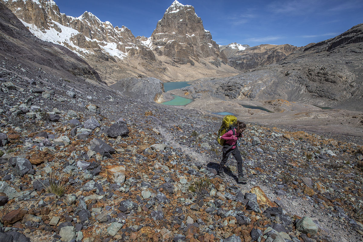 A woman backpacking in the Scarpa Zodiac Plus