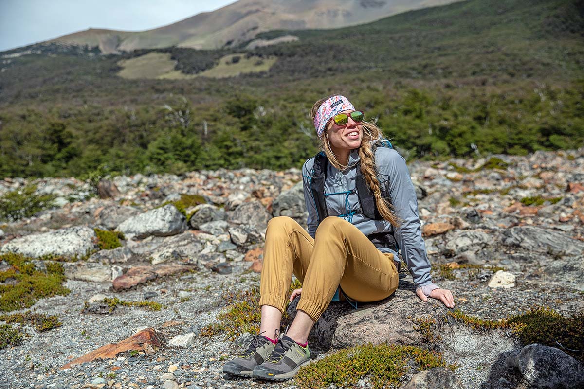 A hiker sits beside the trail and takes a break from traversing.