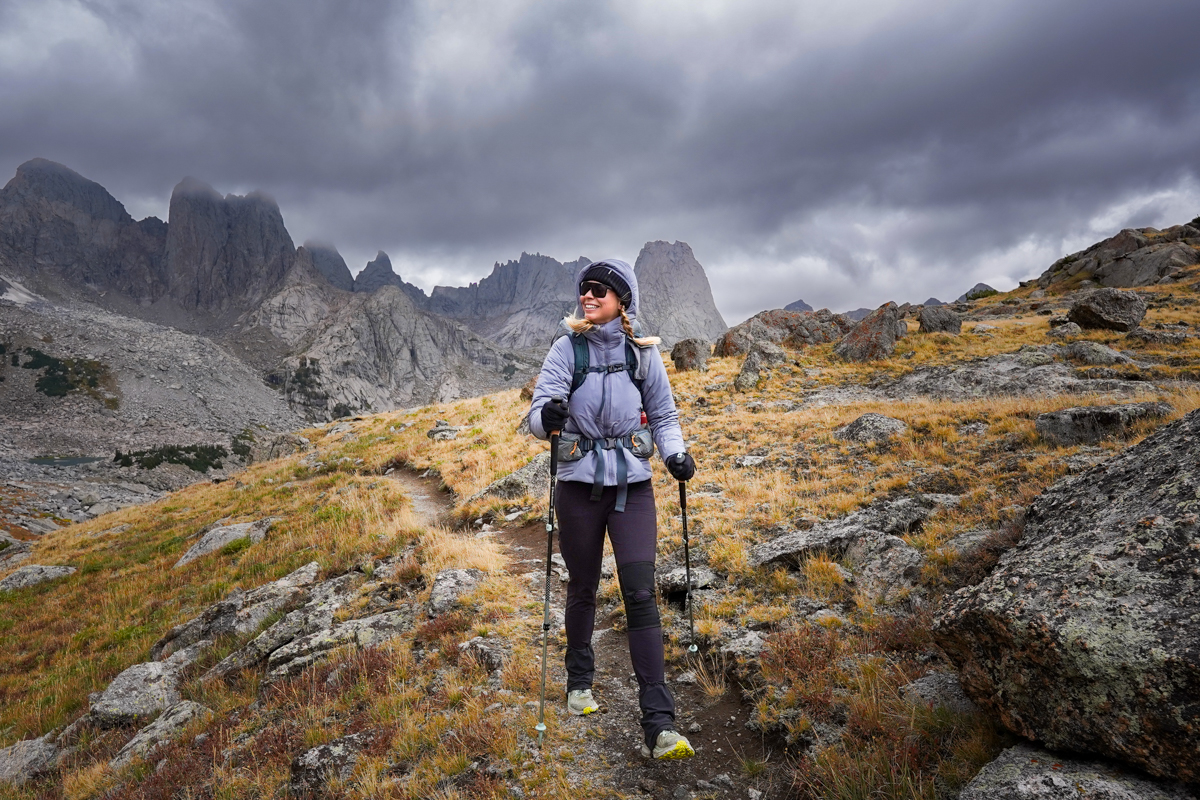 A woman testing synthetic jackets in the Wind River Range