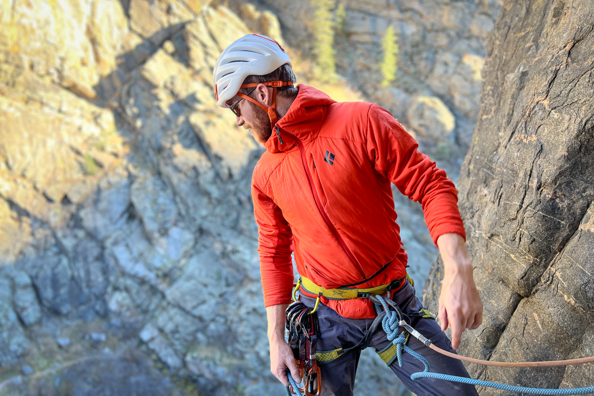 A man rock climbing in a synthetic jacket