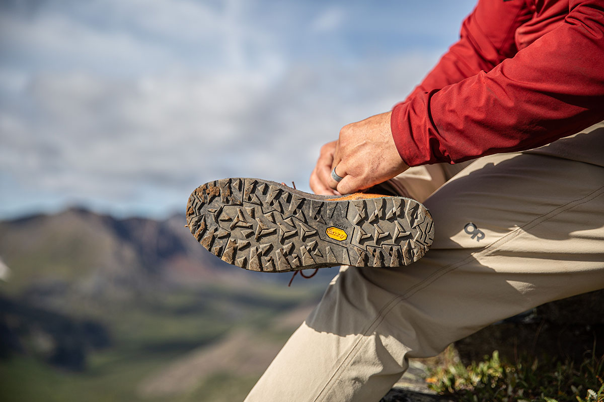 The bottom sole of a boot is visible, with lots of nubby traction.