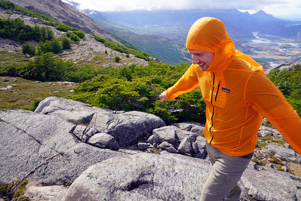 A hiker braces against the wind.